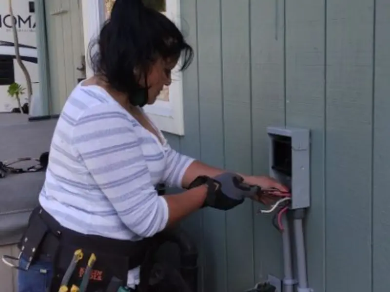 Licensed electrician wiring an exterior subpanel in Northgate